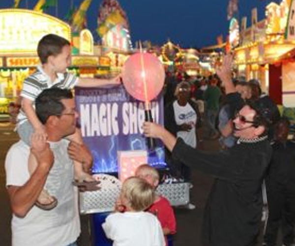 Scott's World Of Magic Performing On Midway