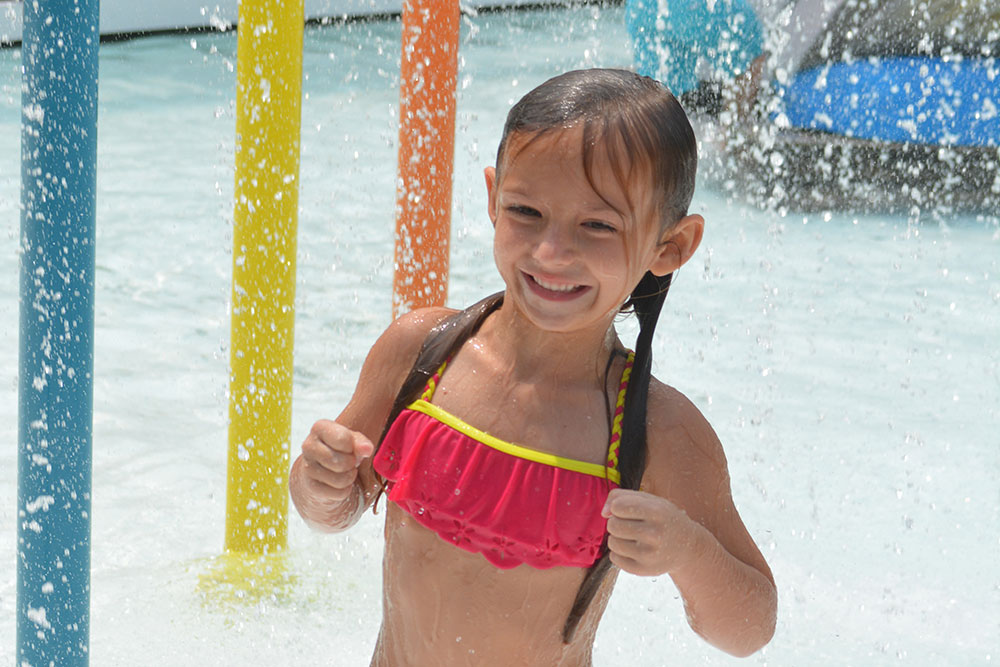 Young Girl Having Fun In Wild Water West Area