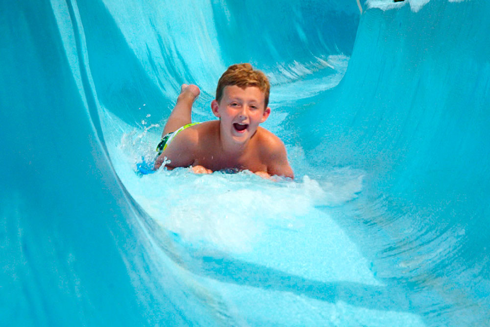 Child On Zoom Flume Water Slide